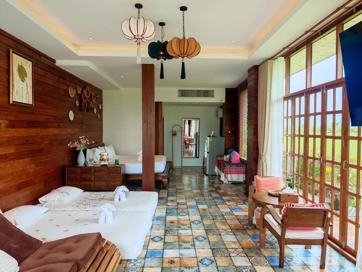 Spacious family room with timber walls and countryside light at Doona Resort