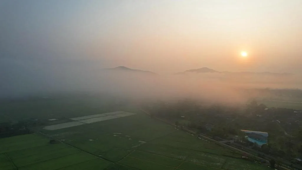Sunrise above the misty Mae Taeng countryside near Doona Resort