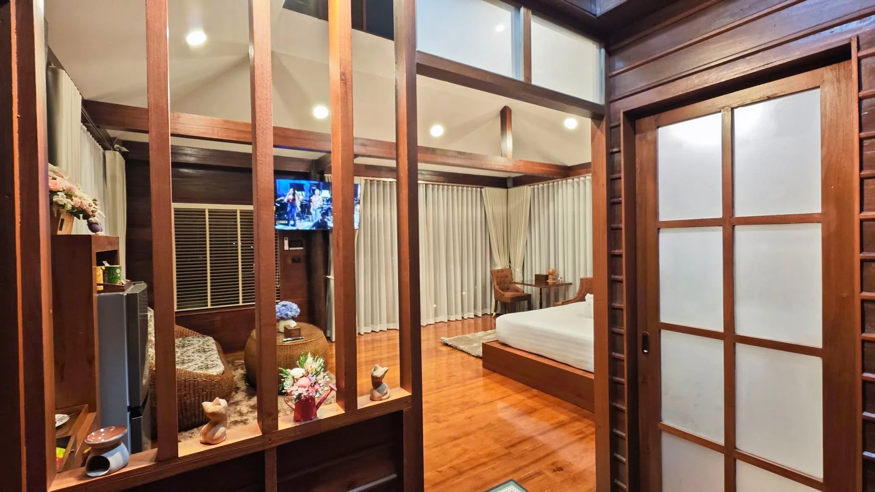 Deluxe room viewed through crafted timber screens